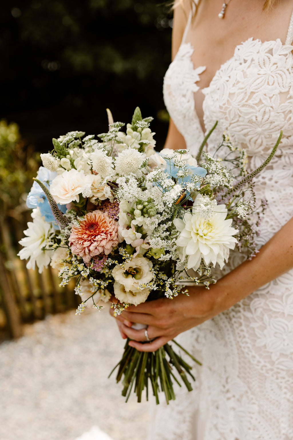 Bridal bouquet and wedding dress at Trevenna barns