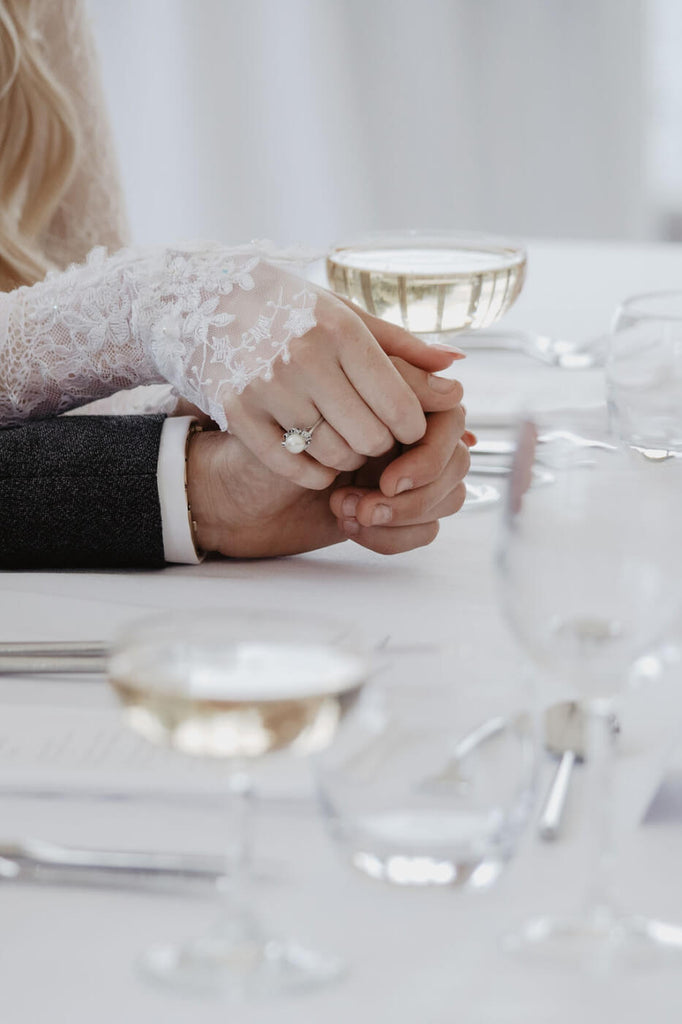 bride and groom holding hands