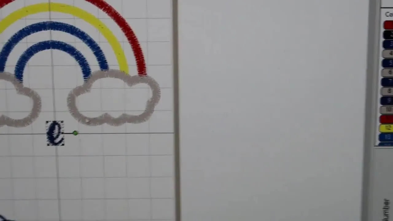 The lowercase 'e' being merged and positioned next to the 'J' on the SewWhat-Pro grid to form part of the name 'Jess'.