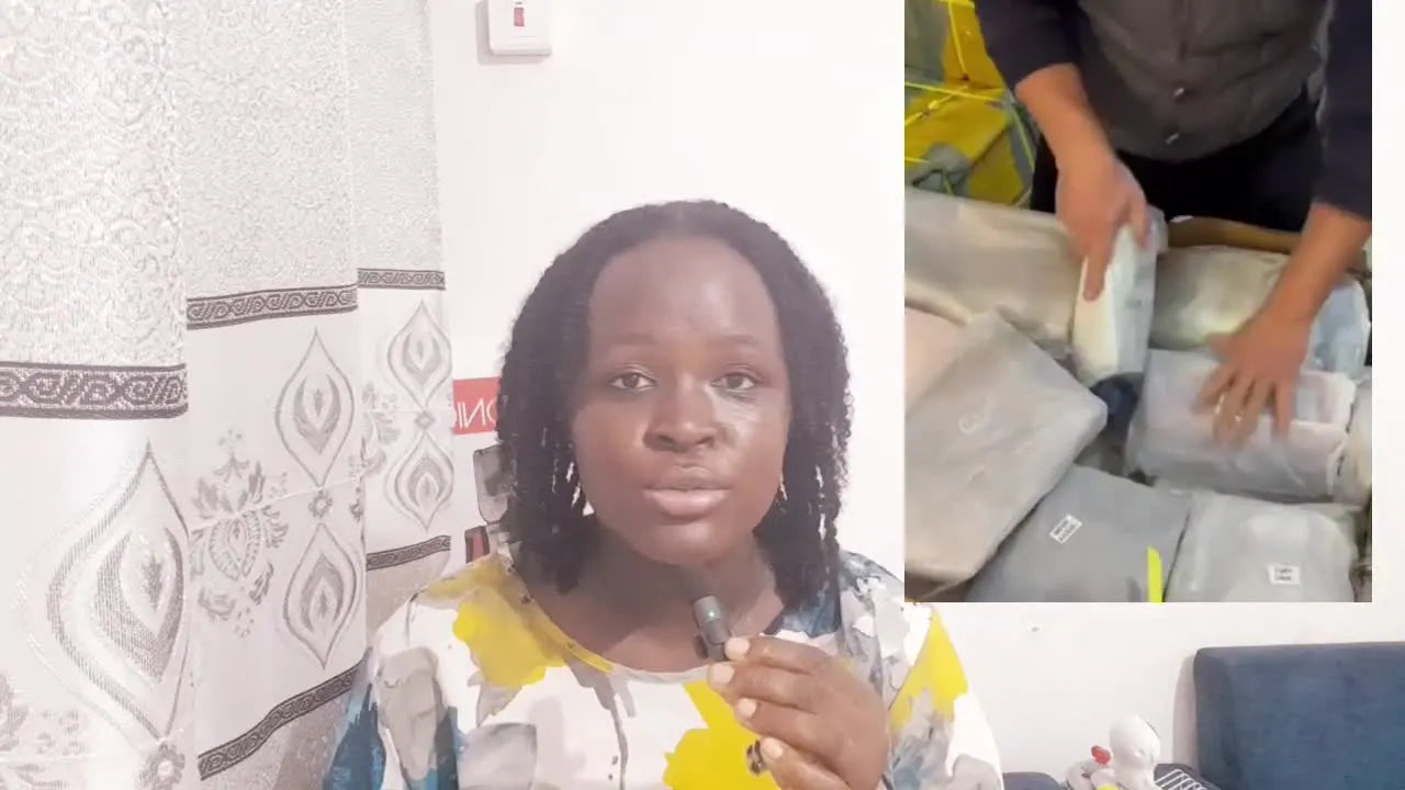 Packaged bags being stacked into a large delivery box.