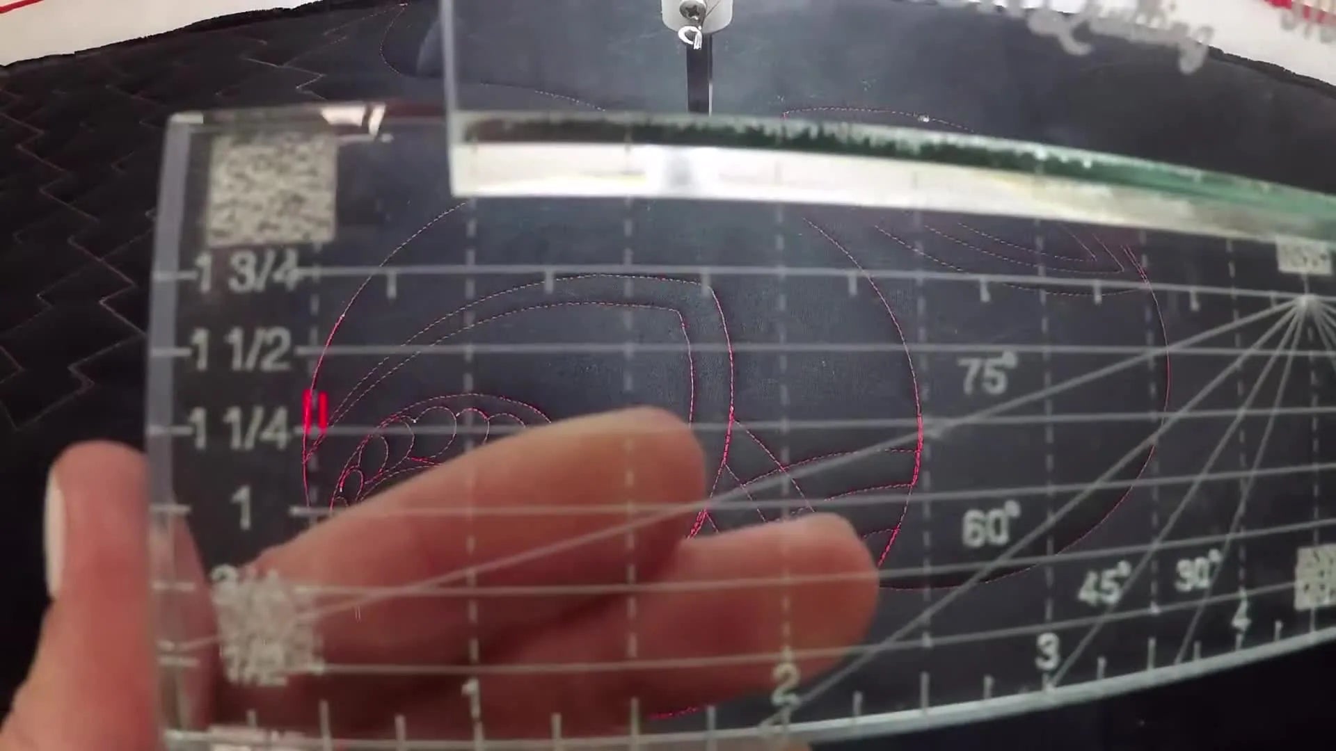 Close-up of 1/4 inch and other measurement markings on the ruler's edge.