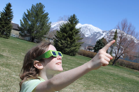 child viewing eclipse