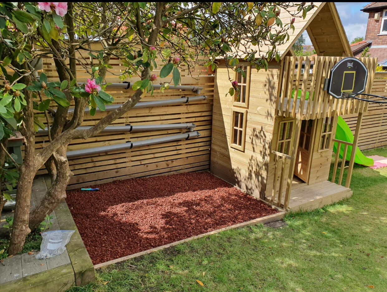 Image of Pink rubber mulch parking lot