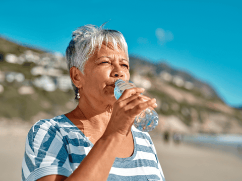 women drinking water to stay hydrated during menopause