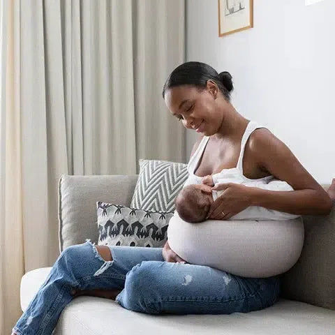 Breast feeding with nursing pillow