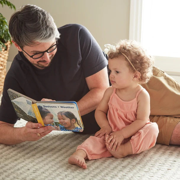 Baby and Parent Reading together