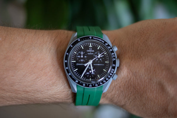 Moon MoonSwatch with dark green watch strap
