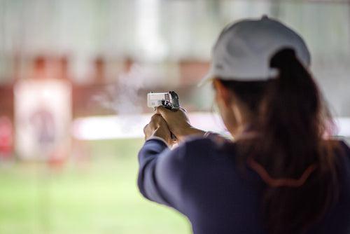 woman practicing shooting