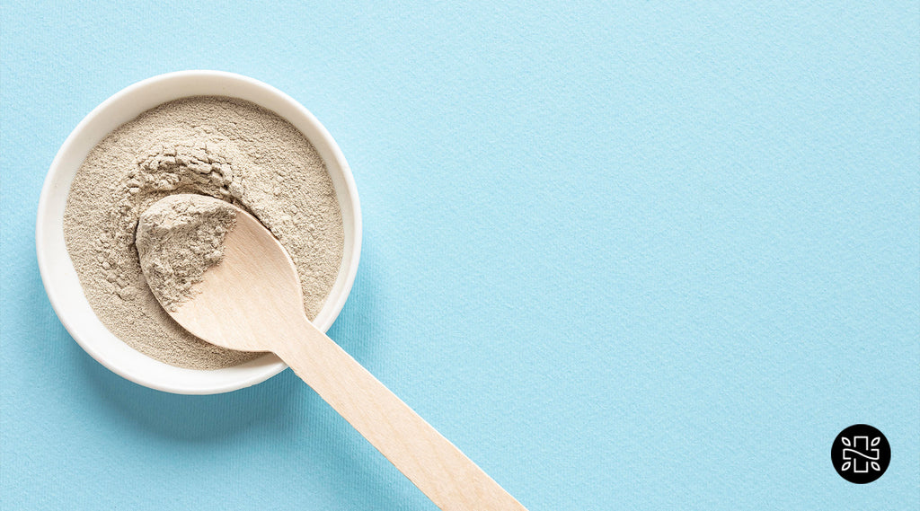 bowl of brown powder with a spoon