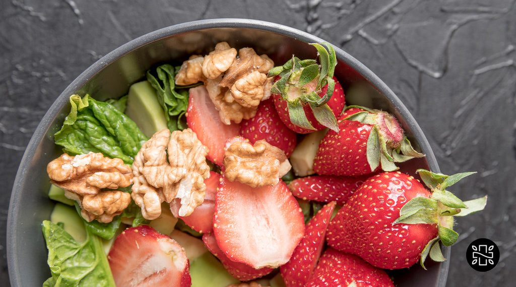 Bowl of nuts and strawberries