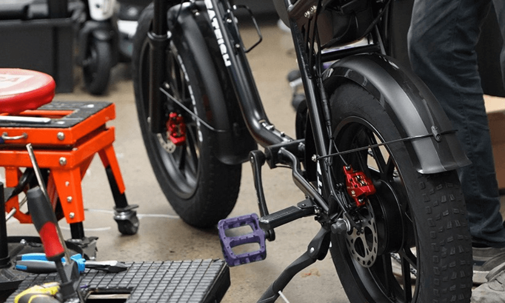 ride electric workshop with bike and mechanic