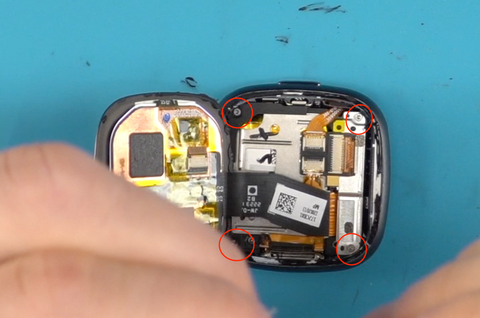 Removing the screw in each corner of the inside of the Versa 4 so that we can remove the screen