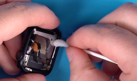 Cleaning the inside lip of the housing on the Series 7 Apple Watch so that the screen can be reinstalled.