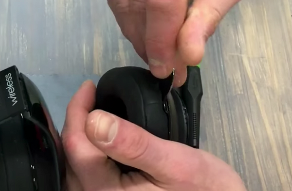 Removing the earpad on the right side of the headphones