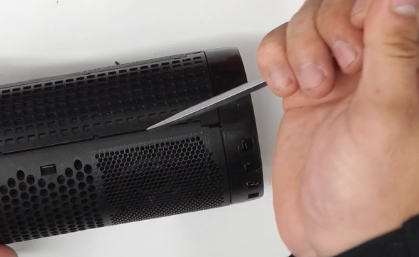 Removing the speaker grill with your flat edge screwdriver