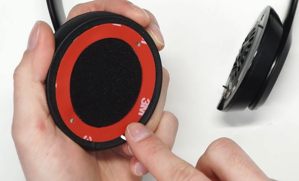Removing the adhesive backing with a flat edge screwdriver