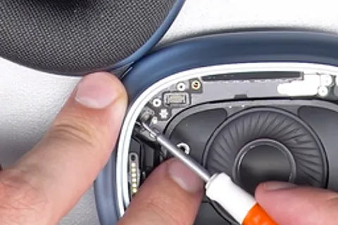Removing ribbon cable with flat screwdriver.