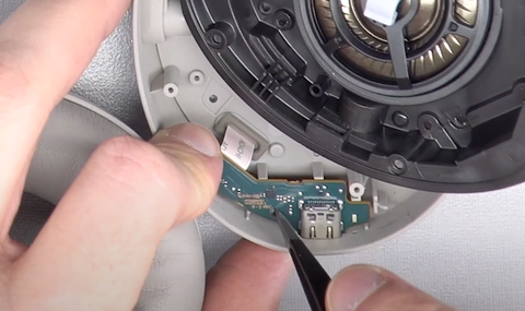 Sliding the PCB out of its place with your tweezers