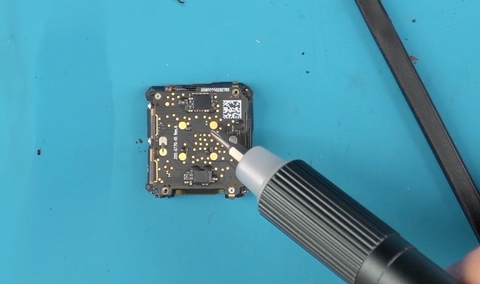 Reinstalling the four screws that hold the battery & motherboard together on the Versa 4