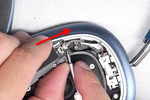 Detaching Bluetooth board and ribbon with flat screwdriver.