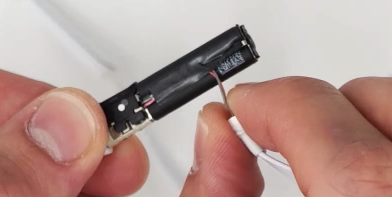 Peel the wires off of the back of the battery