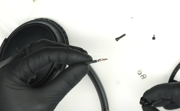 Twisting the main wire so that you can thread it through the swivel