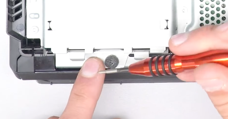 Removing the screw that holds the hard drive in place