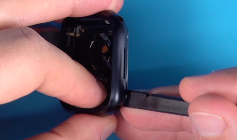 Prying the back cover loose from a Apple Watch Series 7