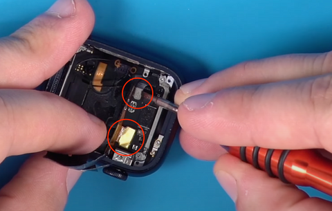 Reconnecting two ribbon connectors inside of the Apple Watch Series 7 during a back cover replacement
