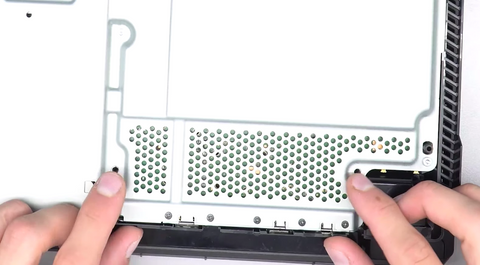 Install the two screws that fit into the bottom of the power supply