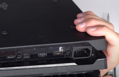 Gently squeeze the two parts of the console together until you hear a click from each corner