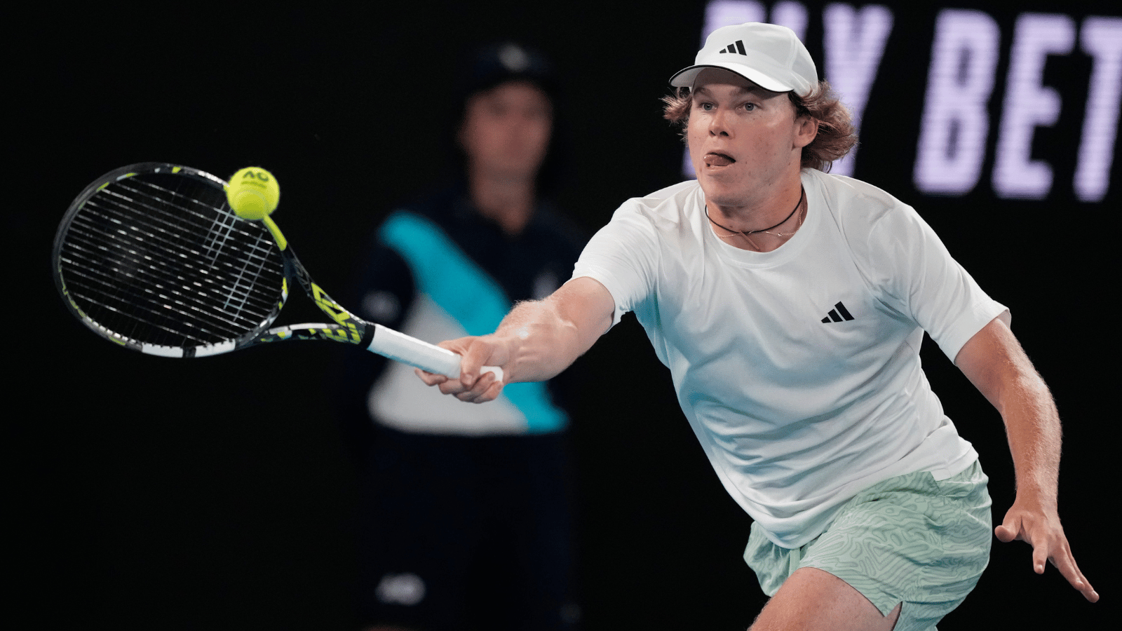 Alex Michelsen hits a forehand at the 2024 Australian Open.