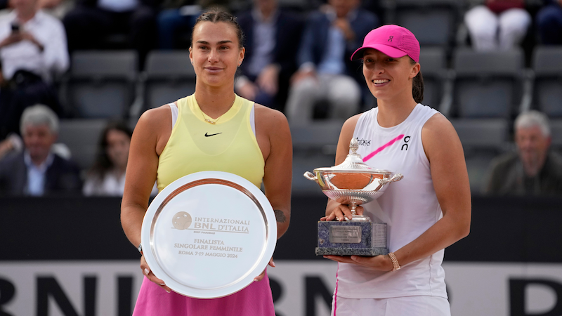 Iga Swiatek and Aryna Sabalenka pose with their Rome trophies.