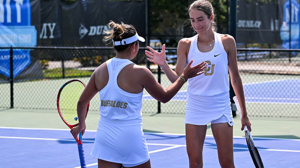 Colorado women's doubles players high five during 2024 UTR Sports NIT Championship