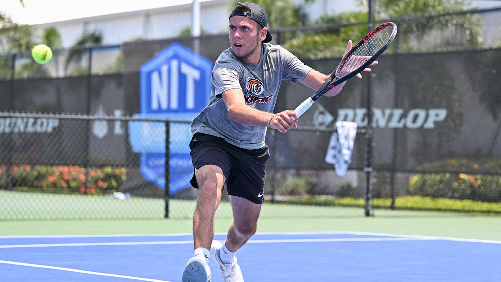 Pacific men's tennis player hits a backhand volley during 2024 UTR Sports NIT Championship