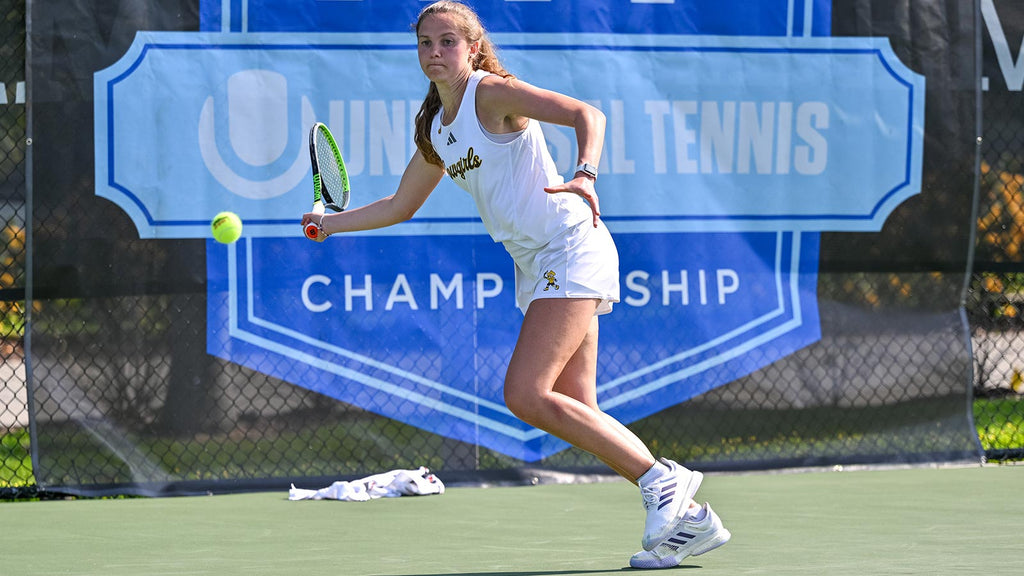 Wyoming women's tennis player hits a forehand at the UTR Sports NIT Championship