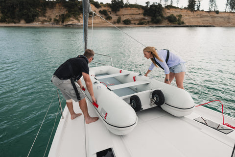 Inflatable catamarans sit flat on a boat deck