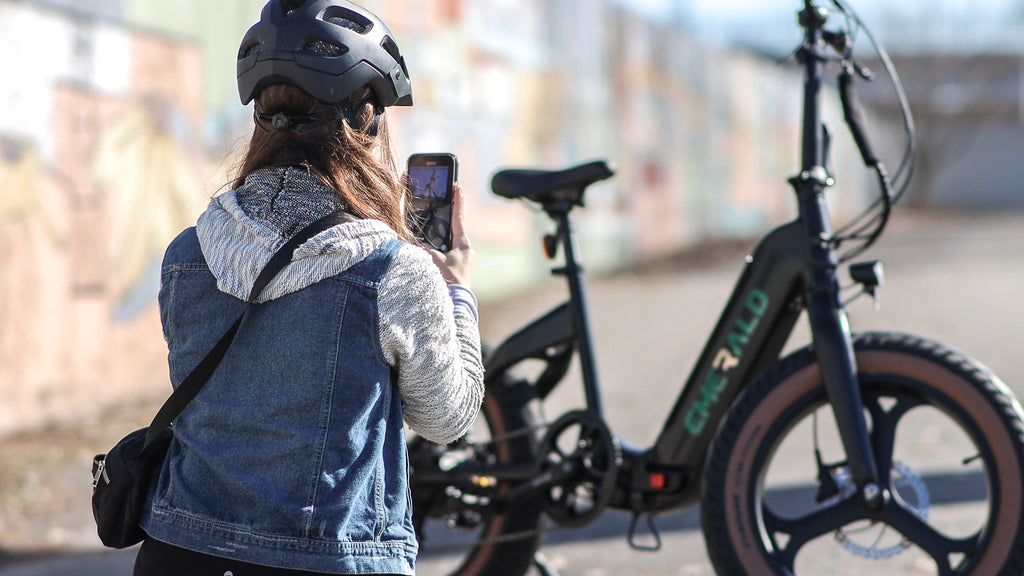 Woman inspecting an Emerald Ebike