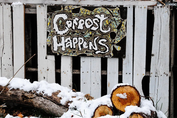 Compost Happens sign in winter