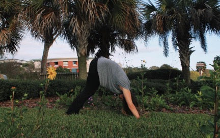  Florida Southern College student, Catie Moat, practices yoga on Lake Hollingsworth.