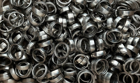 scrapped titanium ratchet rings bundled together