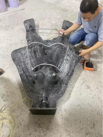 Our team came up with an idea: How about separating the mold and pouring silicone/TPE below the body first, then pour the rest before they solidified.