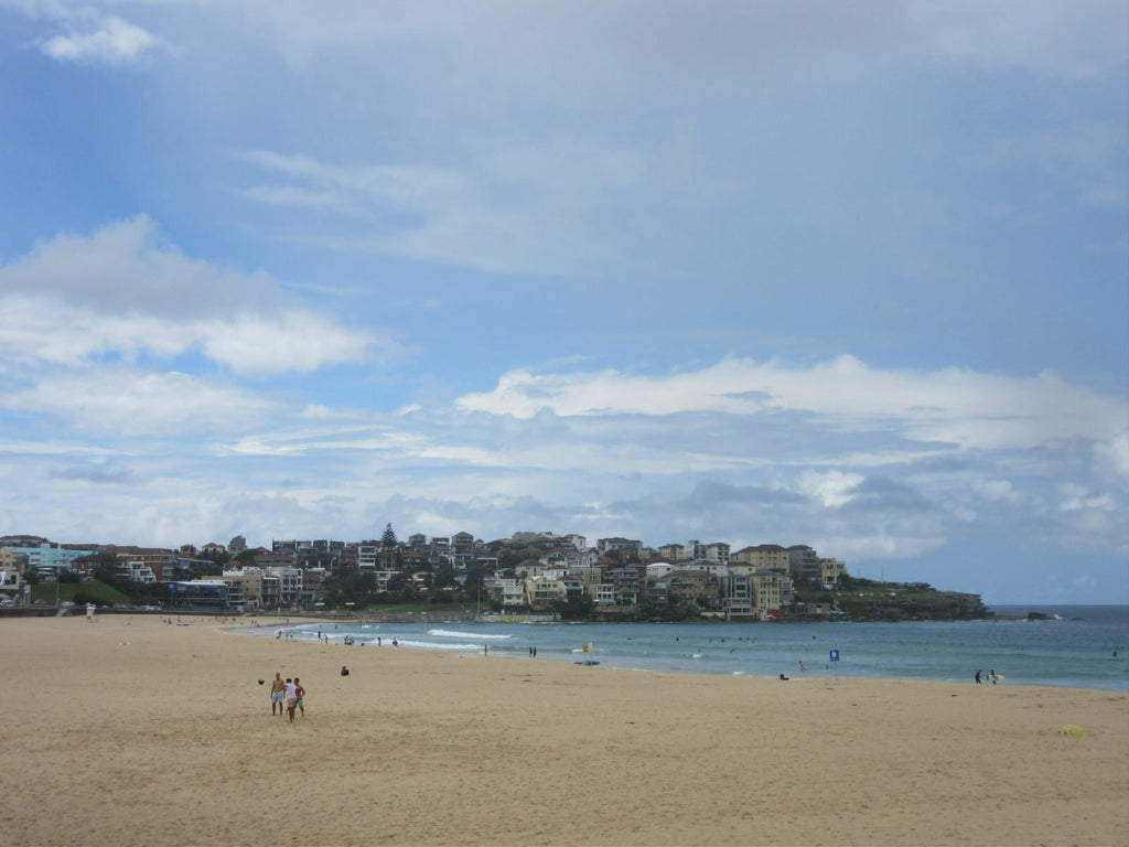 View of Bondi Beach Sydney with buildings on the hills in the background.