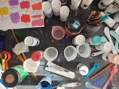 Studio desk covered with paints