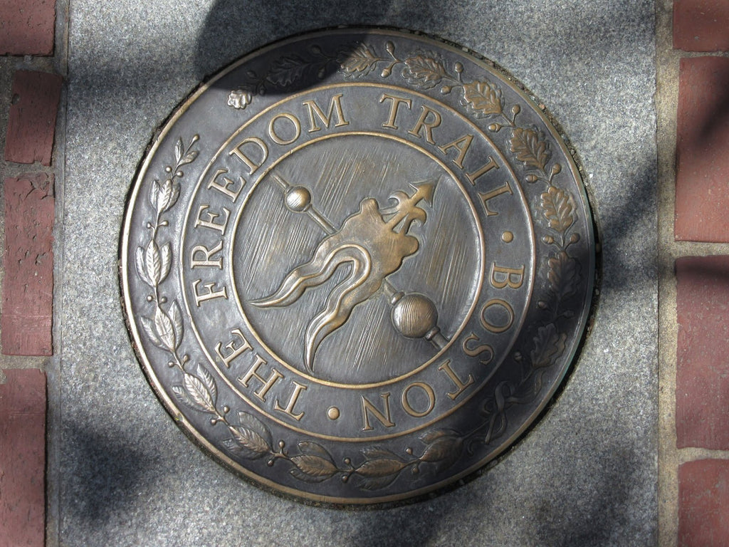 Boston freedom trail roundel on pavement.
