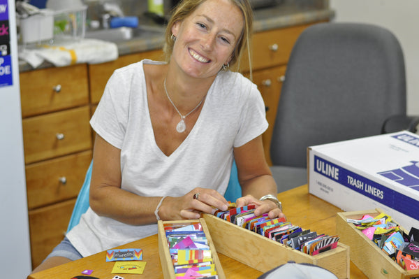 Christie sorts through the patches to pick out a new one for her old trusty hat 