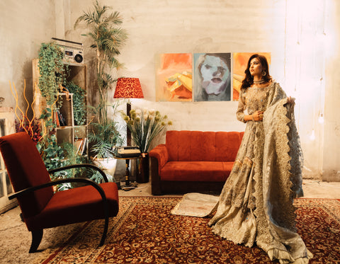 A Woman Posing on a Floral Rug