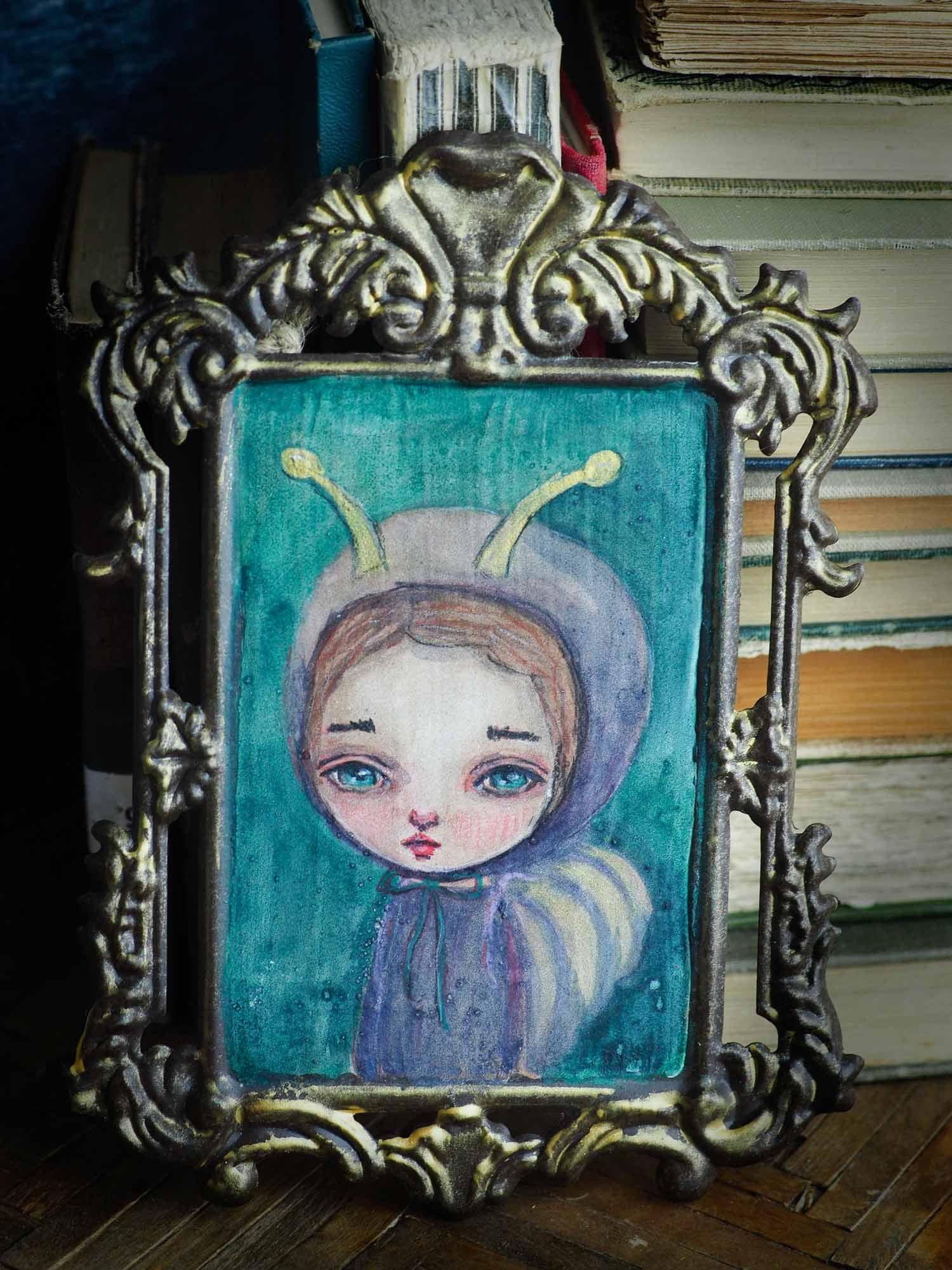 Danita painted a watercolor painting original with a butterfly girl over a metal frame.