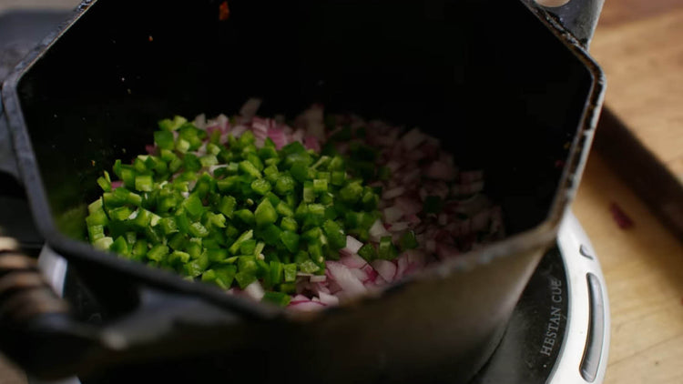 Image of Add the diced onion and jalapeño to the dutch oven...