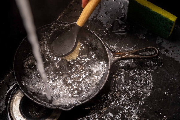 https://cdn.shopify.com/s/files/1/0691/9277/8005/files/how-to-take-care-of-cast-iron-article-clean-with-brush_600x600.jpg?v=1693243899
